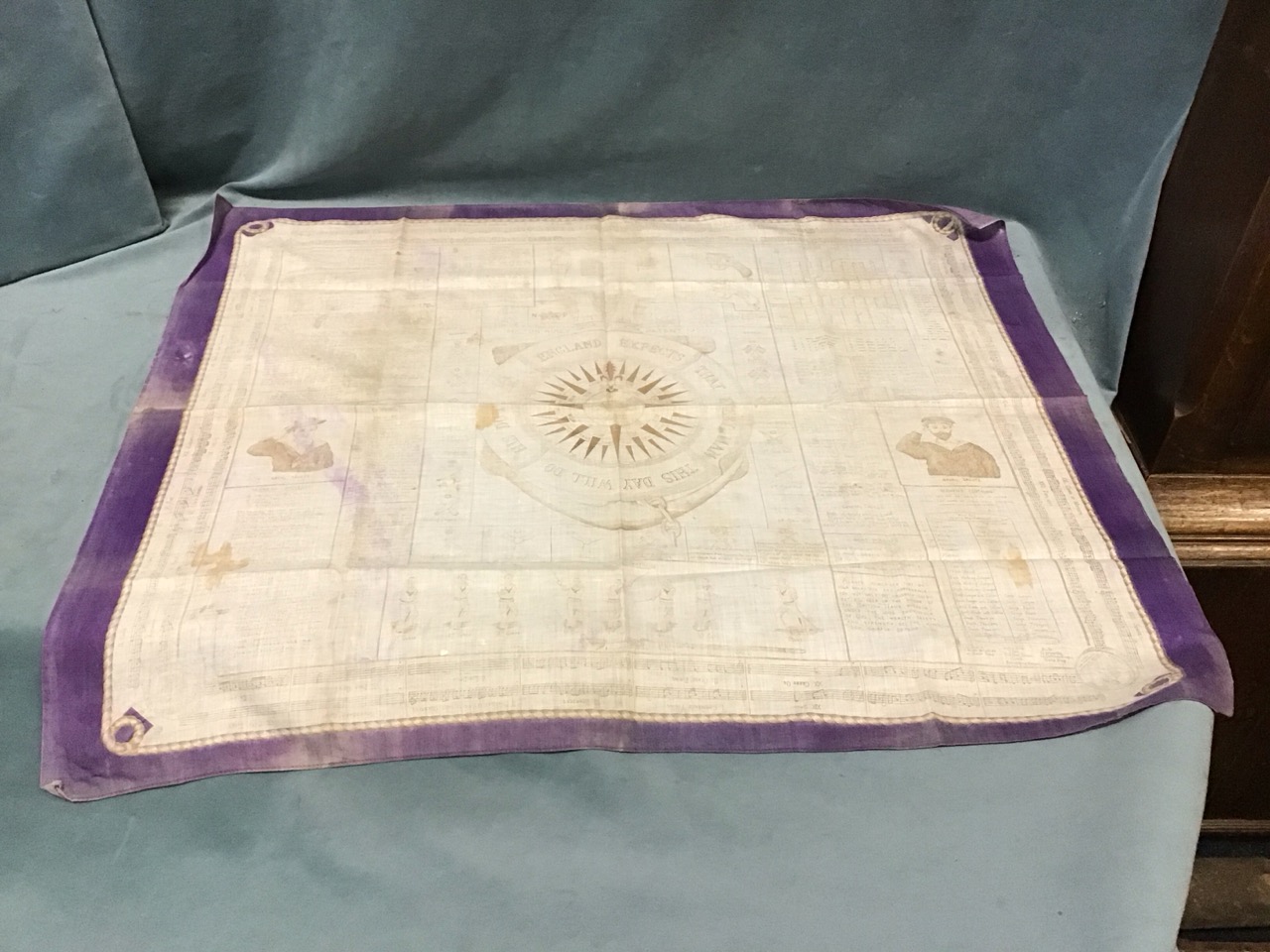 A Victorian printed cotton kerchief with a compass and Nelsons England Expects motto framed by naval