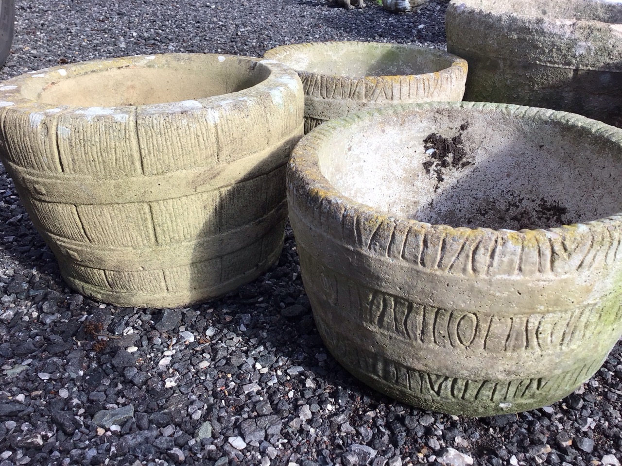A pair of composition stone garden tubs cast as barrels with ring bands; another similar smaller - Image 3 of 3