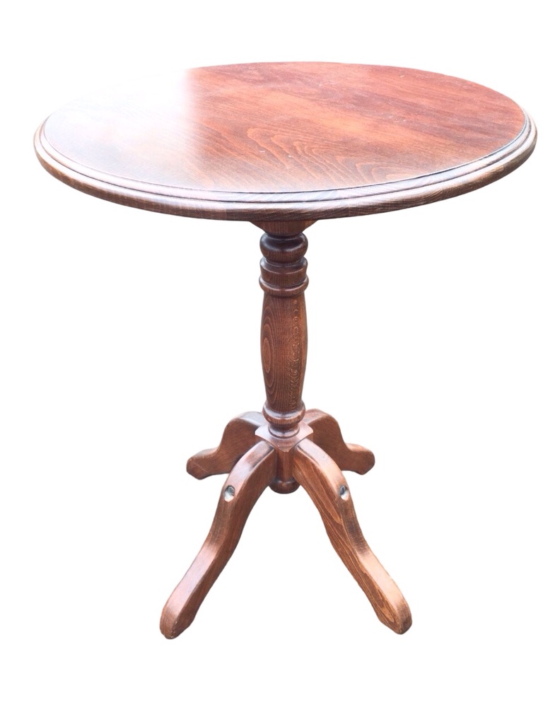 A circular stained pine occasional table with moulded top on turned column with quadripartite shaped