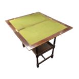 An Edwardian mahogany fold-over card table with rectangular tray top enclosing a baize lined surface