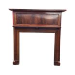 An Edwardian mahogany chimneypiece with moulded rectangular mantleshelf above a scalloped panel,