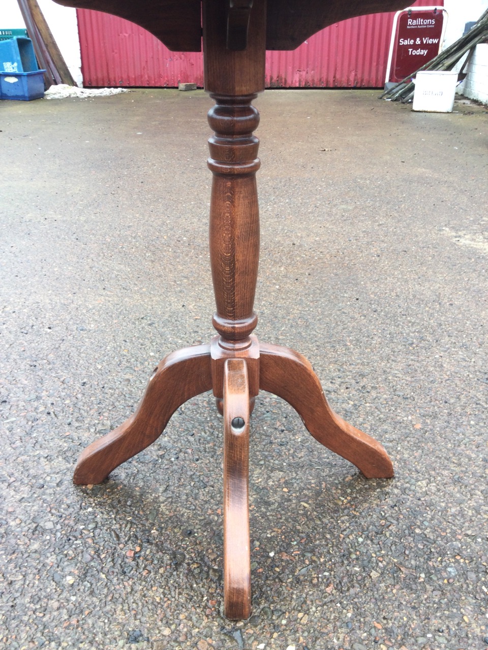 A circular stained pine occasional table with moulded top on turned column with quadripartite shaped - Image 2 of 3