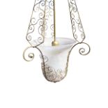 A gilt wirework and glass hanging light with bell shaped ceiling rose and chain suspending three