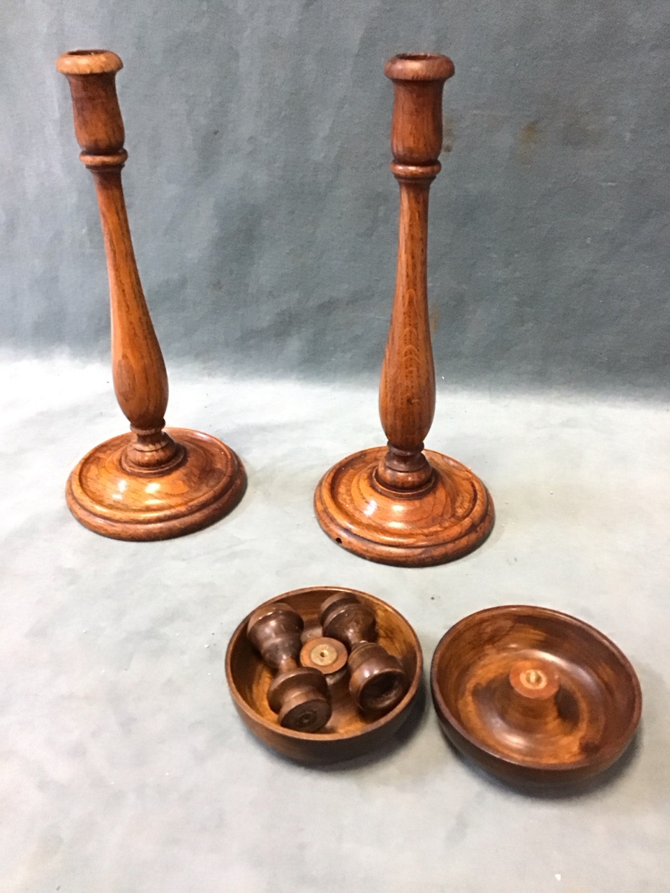 A pair of turned oak candlesticks with baluster columns on circular bases - 12.5in; and a turned - Image 2 of 3