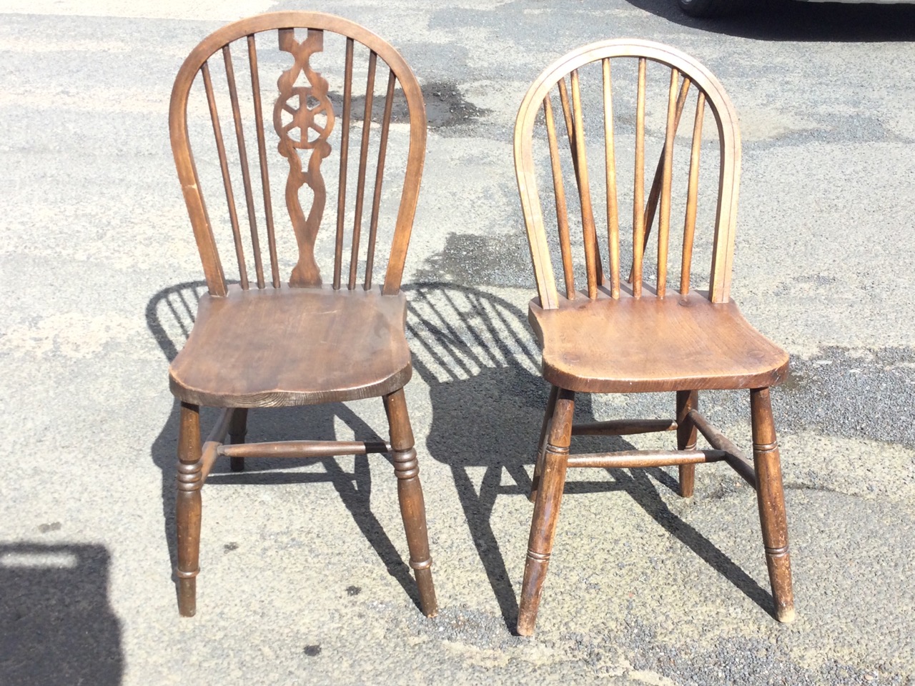 An Edwardian elm chair with hooped spindle back above a solid dished seat raised on turned legs & - Image 3 of 3