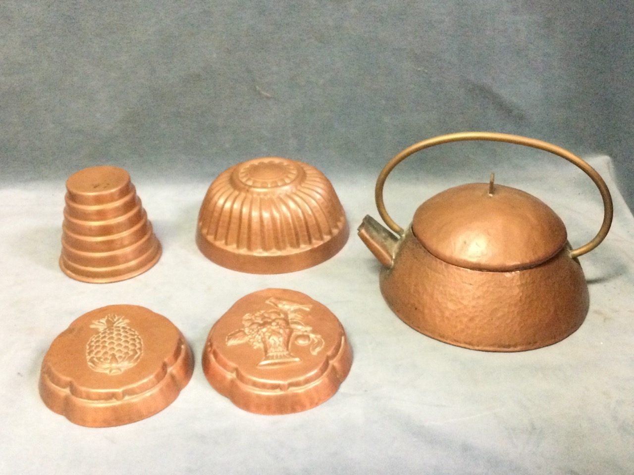 Three ancient Iranian copper vessels with Islamic decoration; four copper cooking moulds; and an - Image 2 of 3