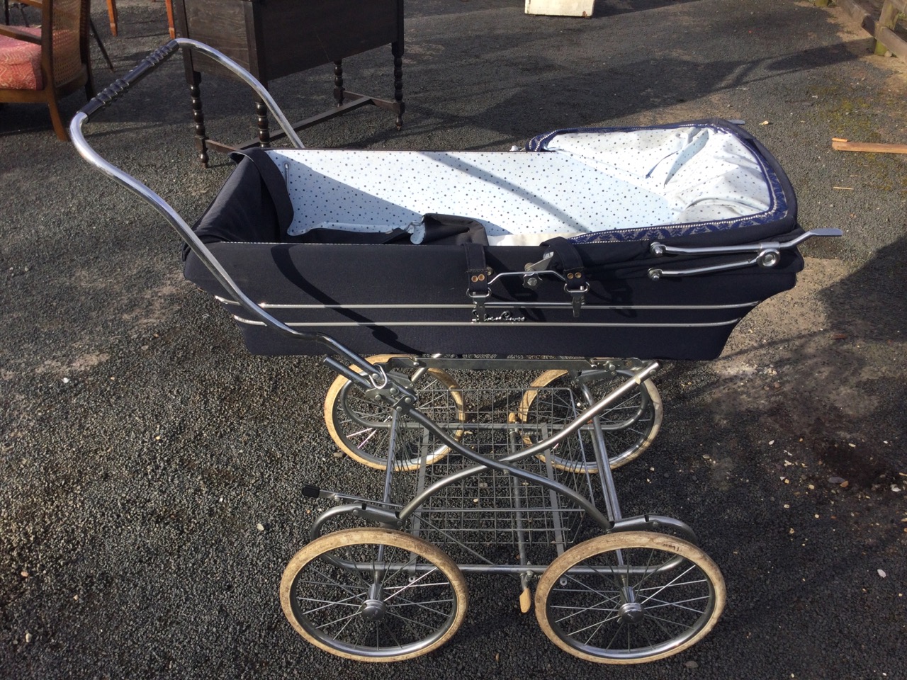 A Silver Cross pram, the detachable canvas body and folding hood with chromed fittings, on a tubular - Image 3 of 3