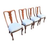 A set of four Edwardian mahogany dining chairs, the waisted backs with vase shaped splats, above