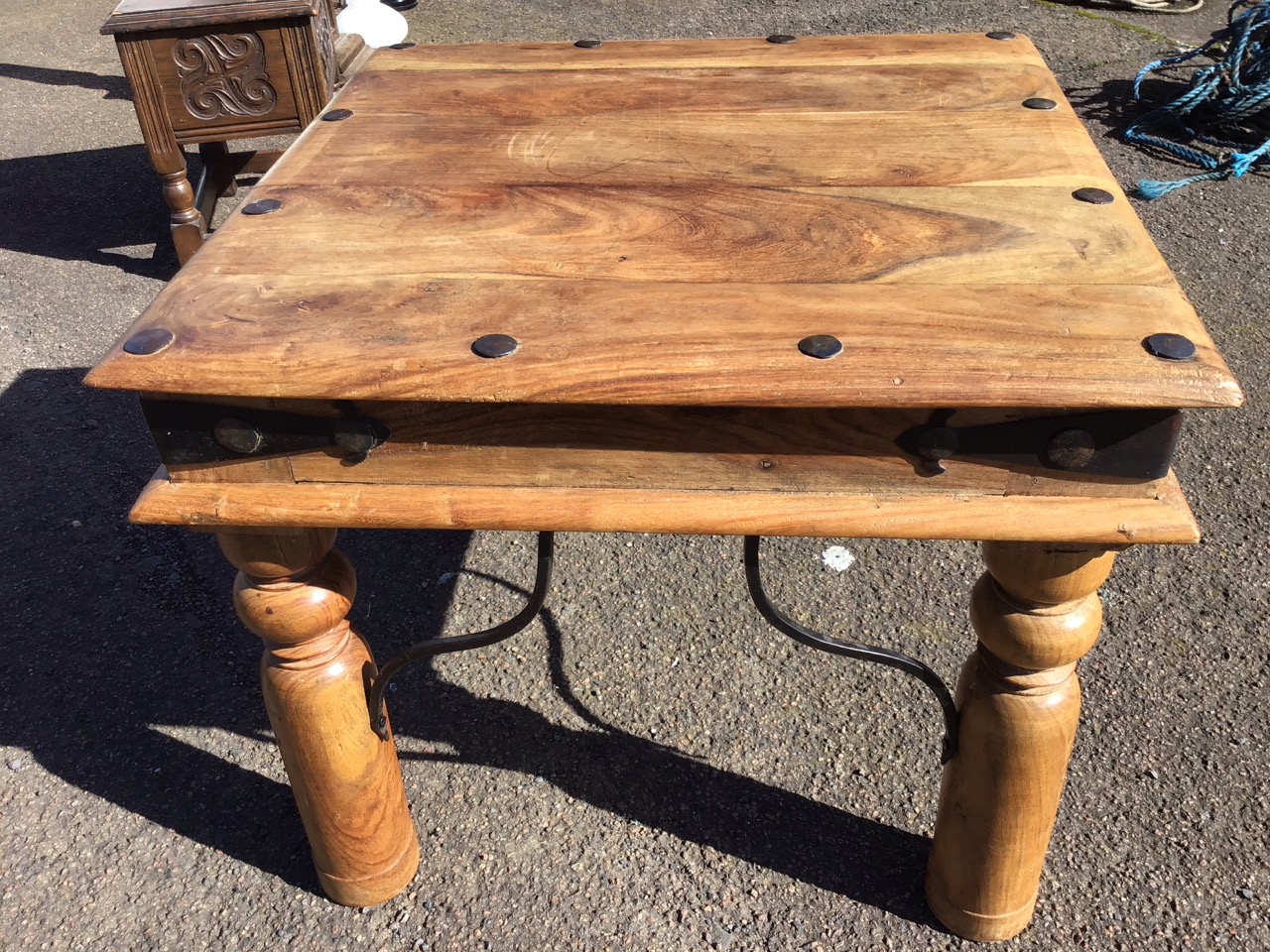 A square hardwood coffee table with hammered wrought iron nailed decoration above a frieze with - Image 3 of 3