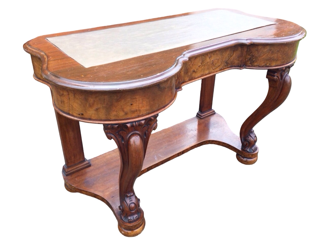 A Victorian walnut & mahogany writing desk, the moulded kidney shaped top set with writing surface