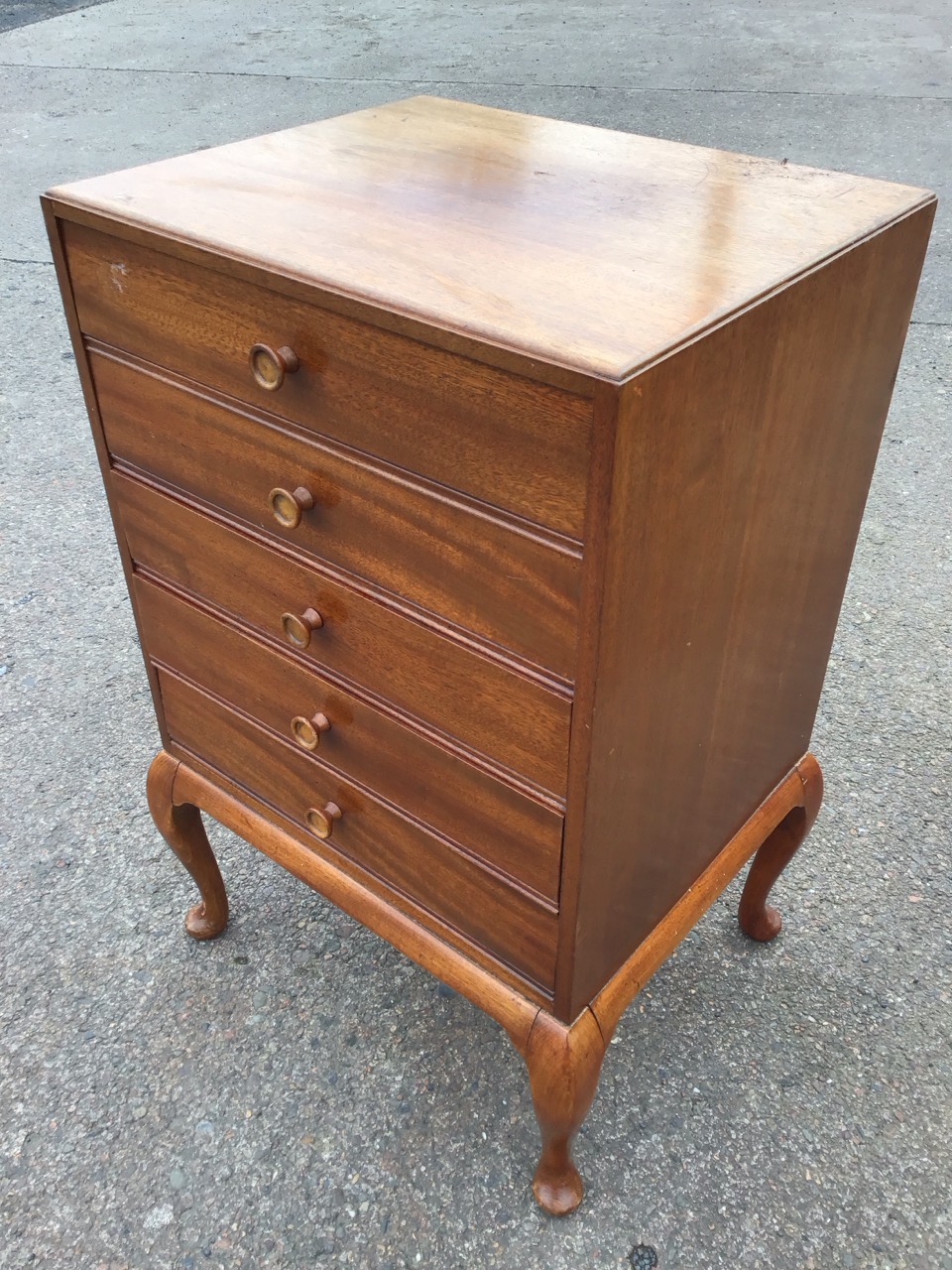 A mahogany music cabinet with five moulded knobbed drop-down drawers, raised on cabriole legs. (20in - Image 3 of 3