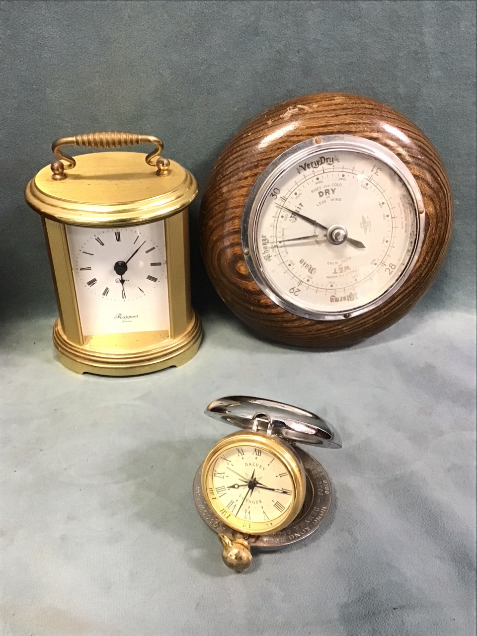 A contemporary cylindrical Swiza stainless steel alarm clock; an oval brass carriage clock by - Image 2 of 3