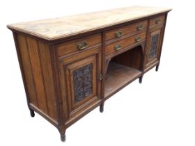 A Victorian oak sideboard, the moulded rectangular top above two central drawers and an open shelf