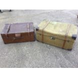 A Nokabout canvas covered trunk with leather handles, batten wood mounts and brass hasp lock; and