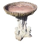 A composition stone birdbath of moulded log form, with circular bowl on treetrunk mounted with