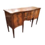 A Georgian style mahogany sideboard, the serpentine fronted top above two central bowfronted drawers