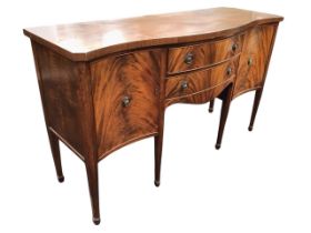 A Georgian style mahogany sideboard, the serpentine fronted top above two central bowfronted drawers