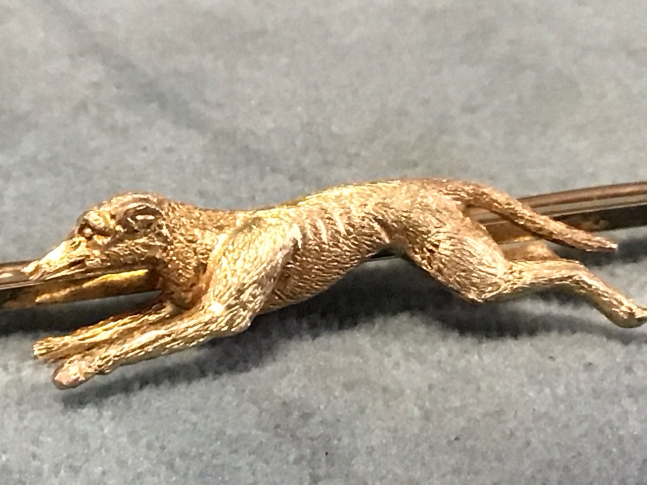 A 9ct gold stock pin with a finely modelled running greyhound. (2.25in) (5g) - Image 2 of 3