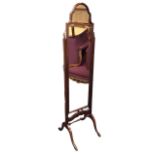 An Edwardian mahogany Queen Anne style cheval mirror with ogee arched mirror swivelling on square