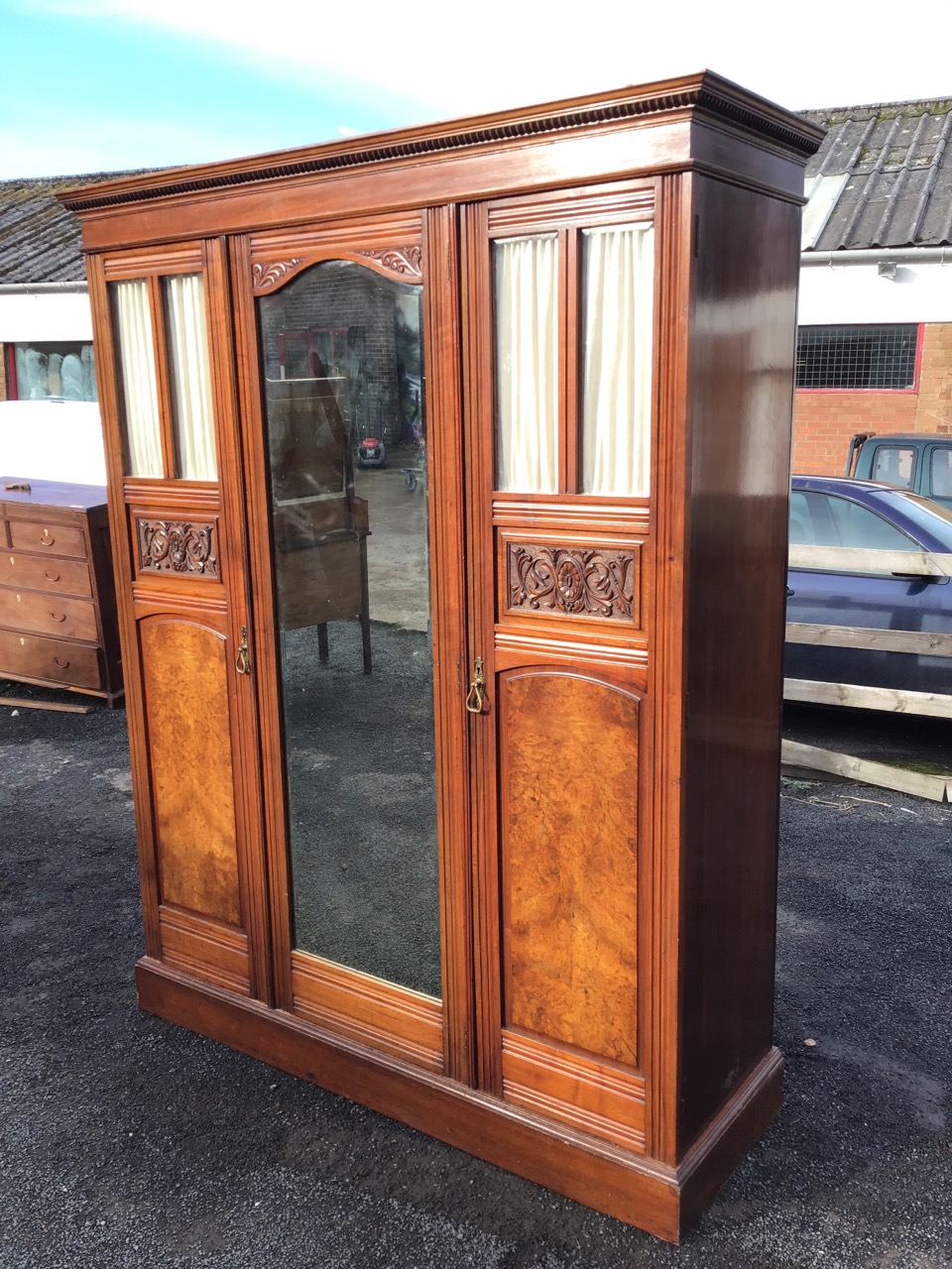 A Victorian mahogany wardrobe with moulded cornice above a central arched mirror door with foliate - Image 3 of 3