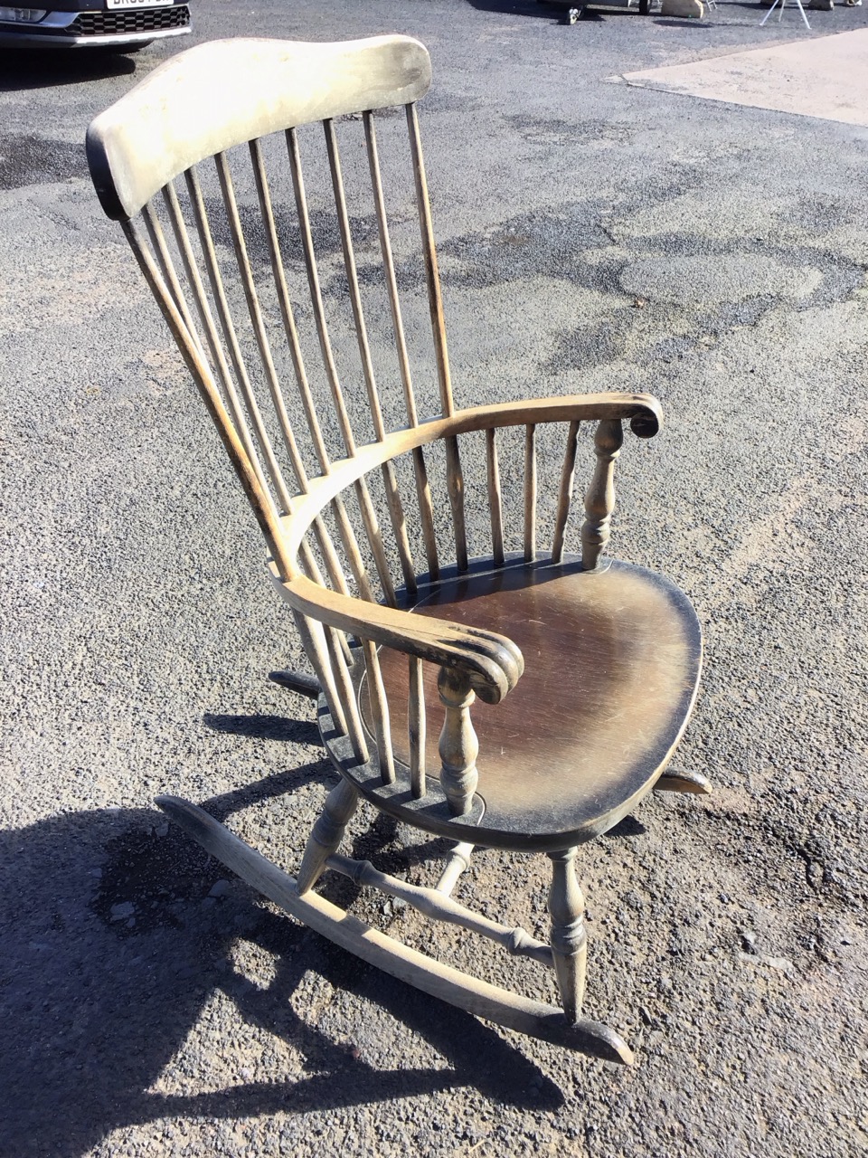 A beech rocking chair with shaped rail back on spindles above a scrolled smokers bow type arm, the - Image 2 of 3
