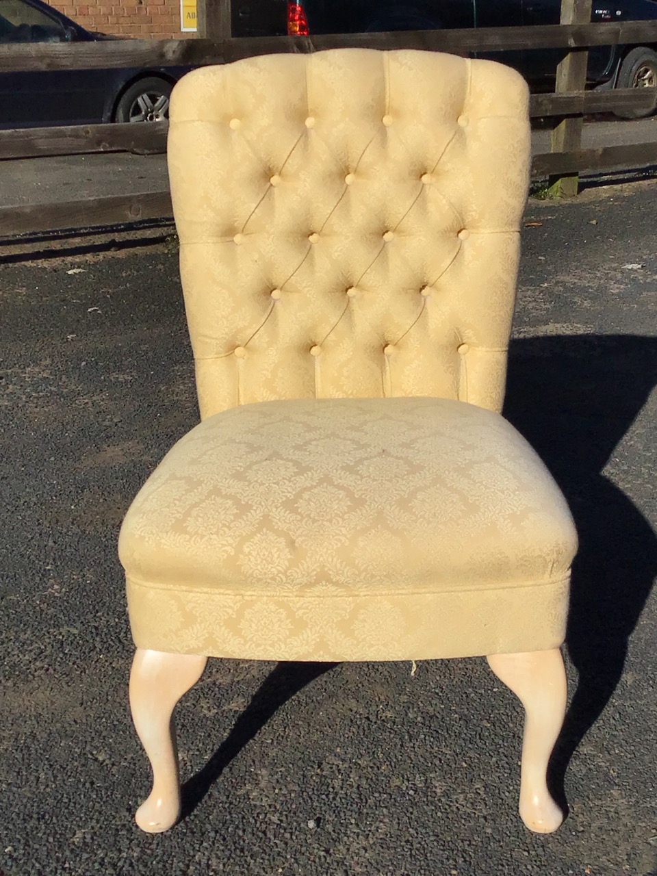 An upholstered chair with buttoned back and flared rectangular roundel seat raised on cabriole legs. - Image 2 of 3