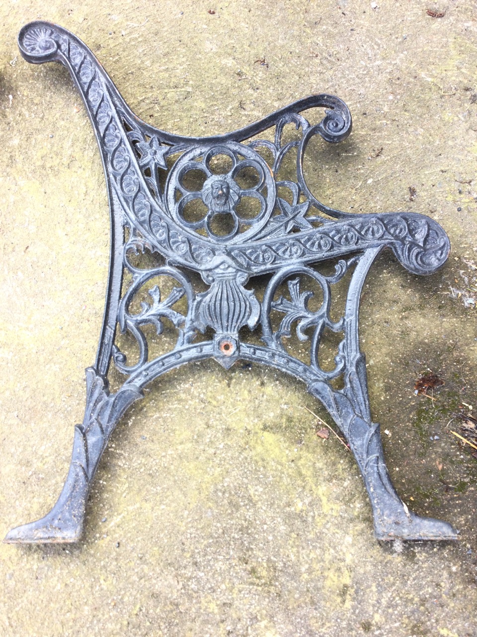 A pair of cast iron bench ends with scrolled arms on pierced circular lionhead medallions, above - Image 3 of 3
