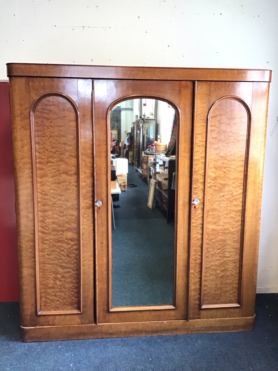 A Victorian mahogany wardrobe with plain cockbeaded cornice above a central arched mirrored door - Image 2 of 3