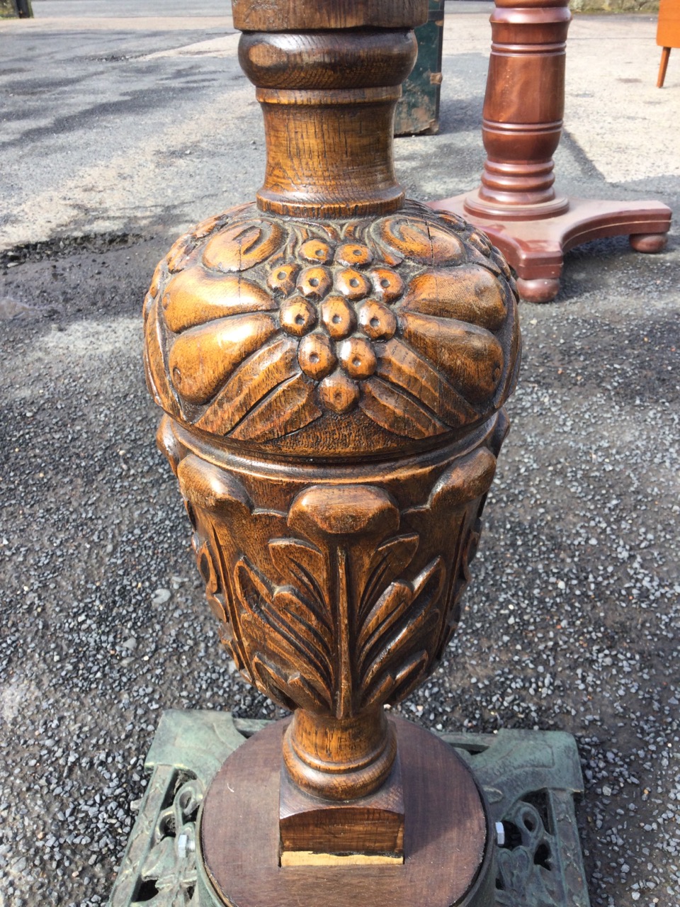 An oak acanthus carved candlestand with copper tray top on column carved with fruit, the cast iron - Image 2 of 3