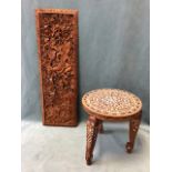 An Indian hardwood low table with circular top profusely inlaid in bone with floral motifs raised on