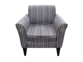 A contemporary upholstered armchair, the rectangular back above a square seat with loose cushion