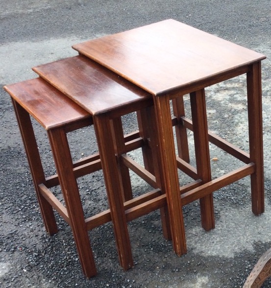 A mahogany nest of three tables with rectangular tops raised on grooved square legs joined by - Image 2 of 3