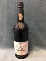 A 1985 bottle of Taylors vintage port, the seal numbered 405781. (75cl)