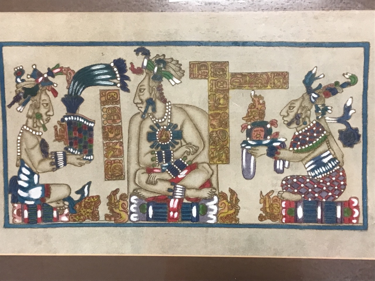 A painted leather Aztec scene of seated figures offering gifts to the emperor, mounted & gilt - Image 2 of 3