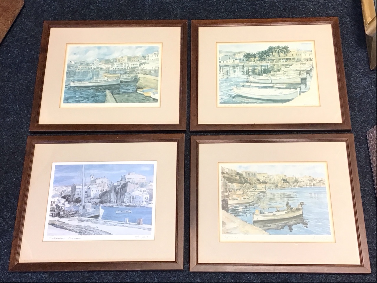 A Moll, a set of four coloured prints, Menorcan harbour scenes titled Cales Fonts, Fornells, Port