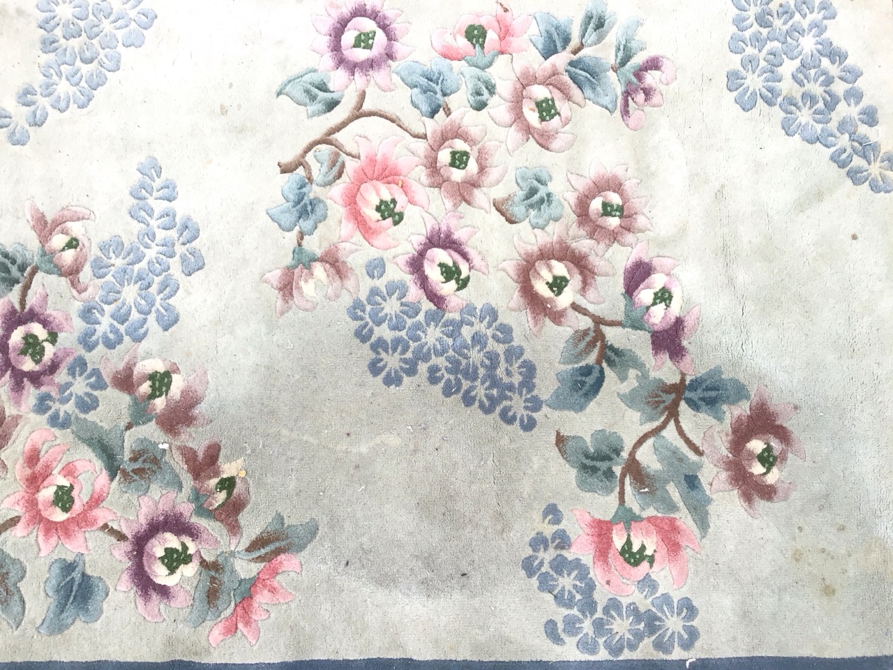A rectangular Chinese wool rug with asymmetrical peony and blossom motifs on a pale blue ground - Image 2 of 3