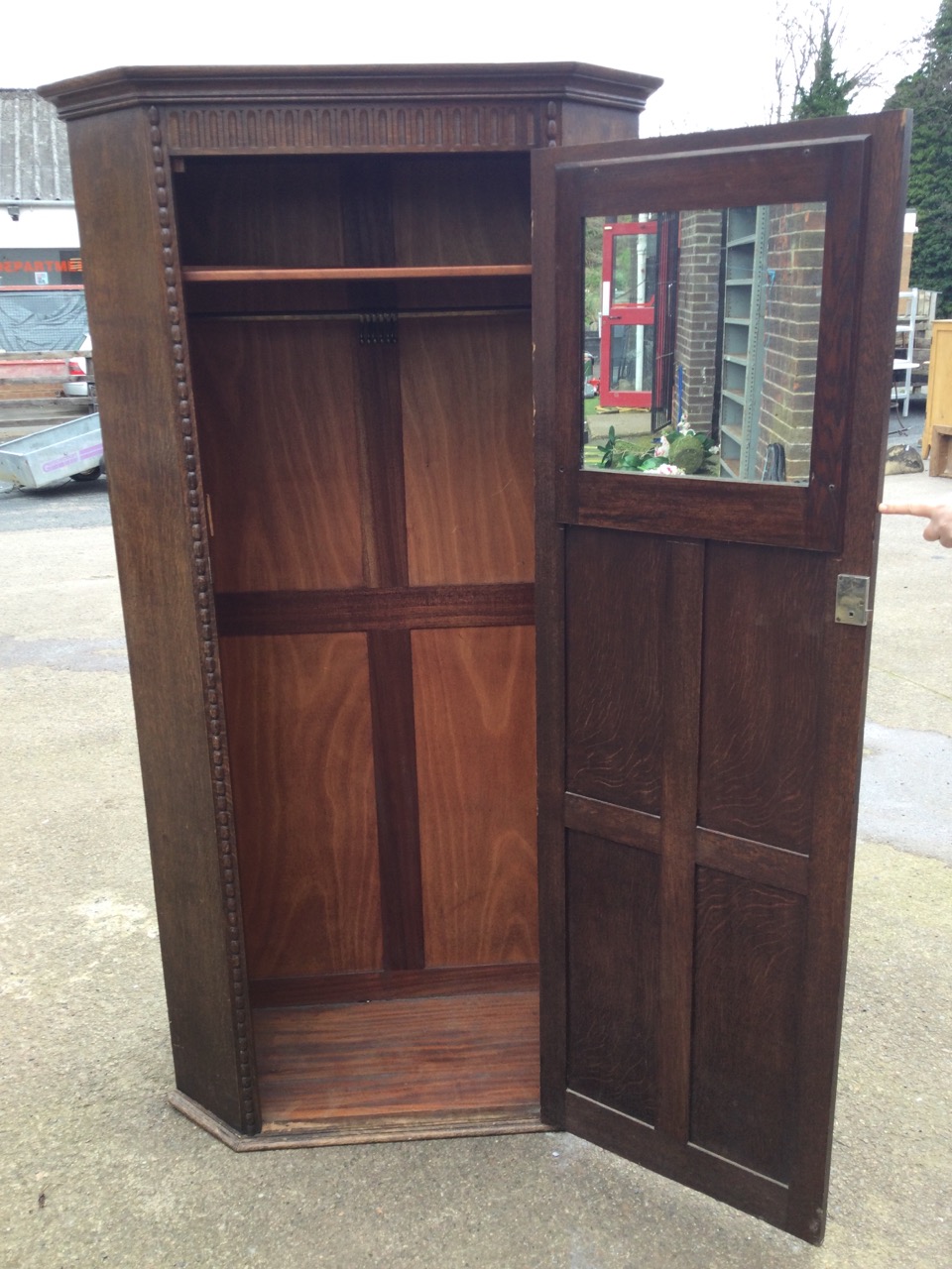 A 50s oak wardrobe with moulded cornice above a fluted frieze and six panelled door enclosing - Image 2 of 3