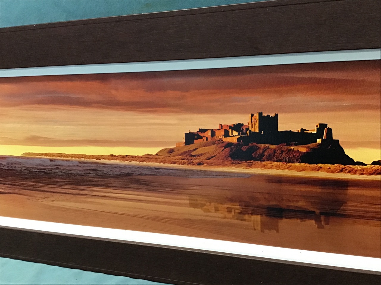 Jim Kearney, photographic canvas evening coastal view of Bamburgh Castle, the label verso numbered - Image 3 of 3