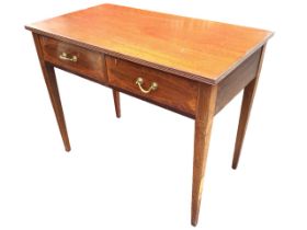 An Edwardian mahogany Georgian style side table with rectangular reeded edge top above two frieze