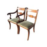A regency style mahogany armchair with rectangular back and lyre carved pierced rail above a drop-in