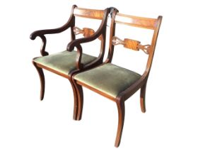 A regency style mahogany armchair with rectangular back and lyre carved pierced rail above a drop-in