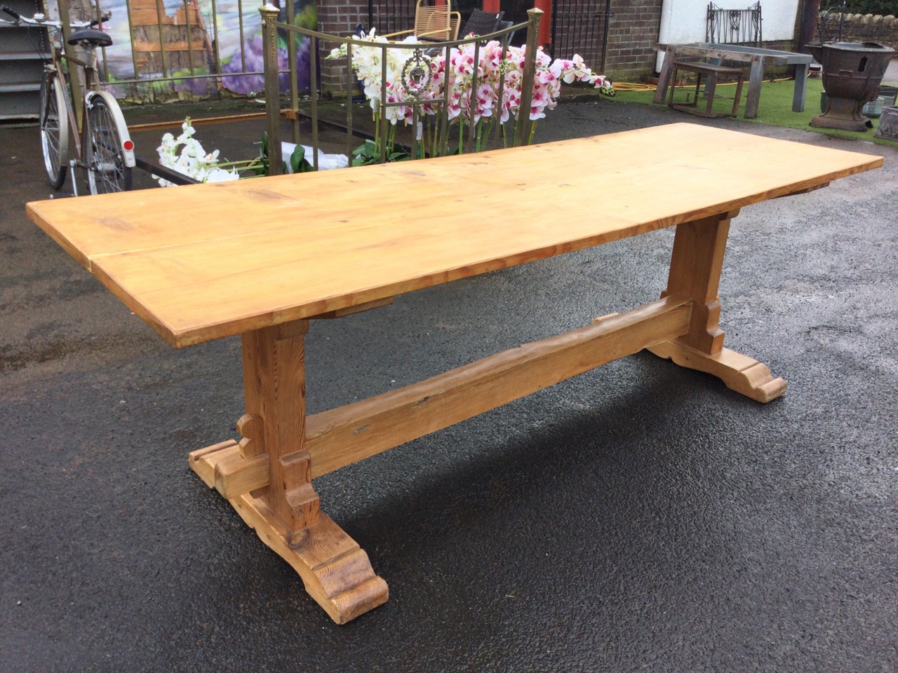 A pine refectory table with long rectangular top on shaped trestle type supports with sledge feet - Image 3 of 3