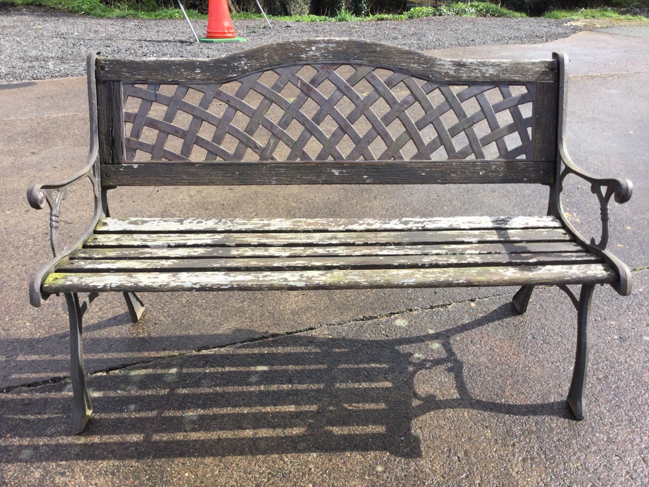 A garden bench with latticework arched metal panel to back above a wood slatted seat, the scrolled - Image 2 of 3
