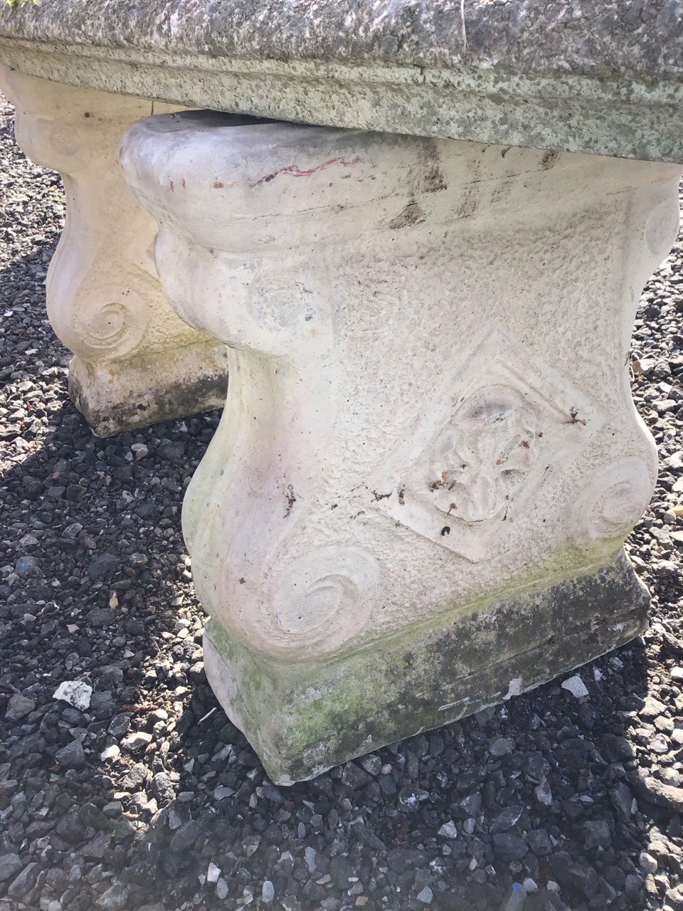 A composition stone crescent shaped garden bench with moulded slab seat on twin scrolled supports - Image 2 of 3