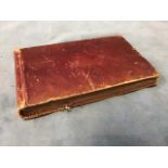 A Victorian leatherbound album with brass catch containing numerous pressed & named seaweed