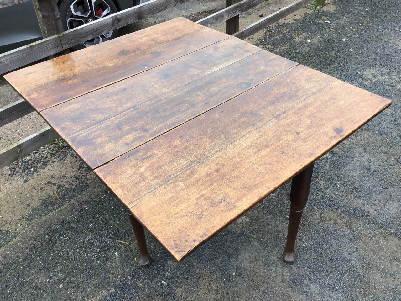 A Georgian oak dropleaf dining table, the rectangular top with two leaves opening on swing legs, - Image 2 of 3