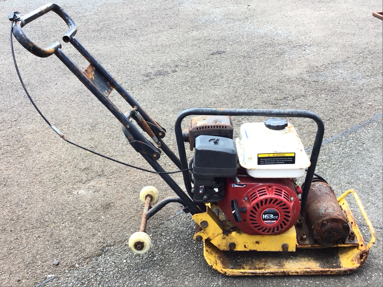 A petrol powered ground wacking machine with trolley wheels and 166cc engine. (A/F)