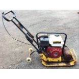 A petrol powered ground wacking machine with trolley wheels and 166cc engine. (A/F)