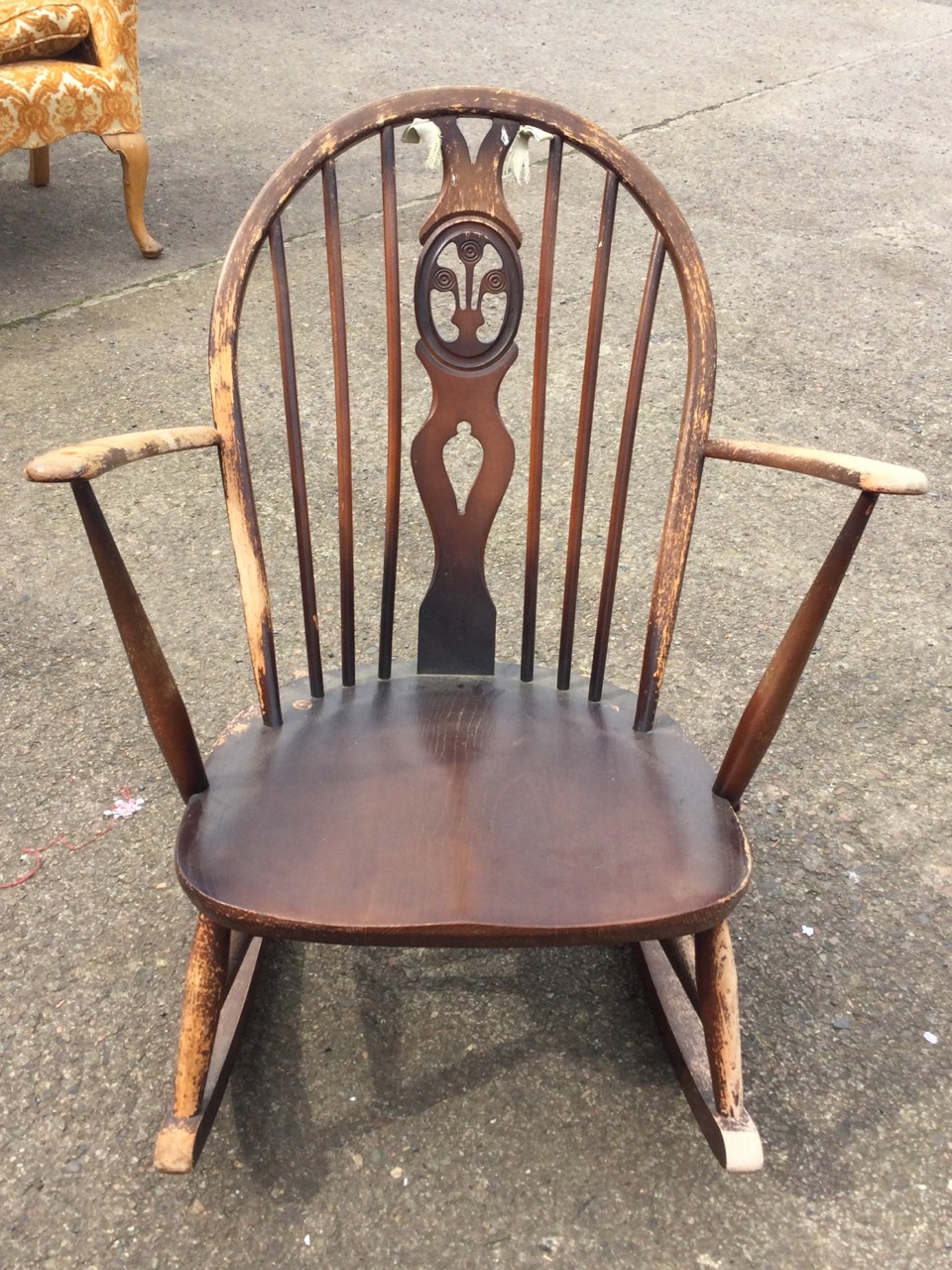 An Ercol elm & beech rocking chair with arched spindled back and Prince of Wales feather pierced - Image 2 of 3