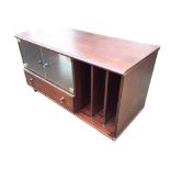 A contemporary mahogany cabinet with moulded top above glass doors, three-division compartment and